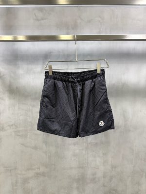 Black on black Moncler all-over ‘M’ pattern monogram-jacquard swim shorts