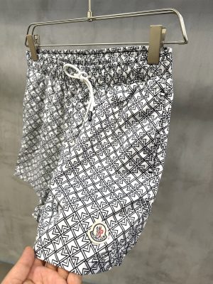 White Moncler all-over ‘M’ pattern monogram-jacquard swim shorts